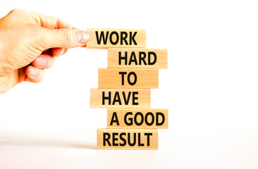 Work hard for result symbol. Concept words Work hard to have a good result on wooden blocks on a beautiful white table white background. Businessman hand. Business work hard for good result concept.
