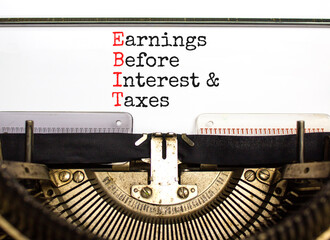 EBIT symbol. Concept words EBIT earnings before interest and taxes typed on retro typewriter on beautiful white background. Business EBIT earnings before interest and taxes concept. Copy space.