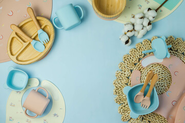 A set of children's silicone dishes. Baby feeding and nutrition concept. Top view, flat lay.