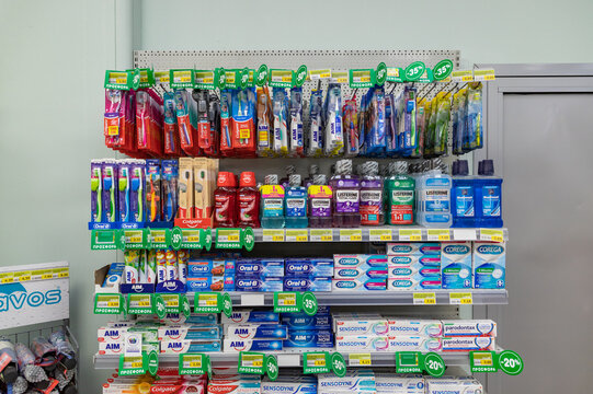 Athens, Greece - November 12, 2022: A picture of multiple oral hygiene products, such as toothpaste and toothbrushes, inside a supermarket.