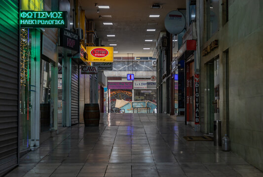 Athens, Greece - November 13, 2022: A picture of a commercial gallery in Athens sided with shops.