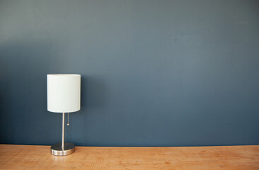 isolated lamp over blue wall