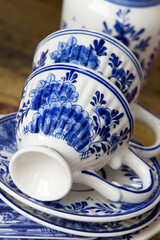 Closeup of old blue porcelain cup - obrazy, fototapety, plakaty