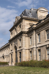 Architectural fragment of the facade of the military school (Ecole Militaire) founded in 1750 in Paris. Artillery (Artillerie) building. Paris, France. 