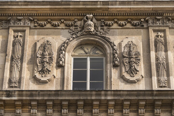Architectural fragment of the facade of the military school (Ecole Militaire) founded in 1750 in Paris. Artillery (Artillerie) building. Paris, France. 