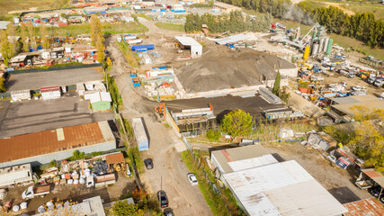 Aerial view of an industrial area. The construction site is at work.