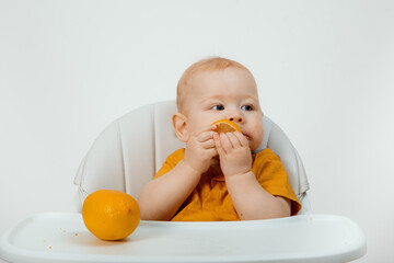 The child eating a delicious, juicy lemon,healthy life.