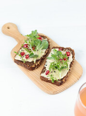 A healthy snack. Lunch. Sandwiches with hummus and micro-greenery. Close-up.