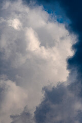 Fototapeta na wymiar close up of fluffy light and dark cumulus clouds