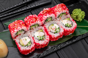 California sushi roll with crab, avocado, cucumber and tobiko caviar served