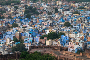 Aerial view of blue city, Jodhpur, Rajasthan,India. Orange sky background. Resident Brahmins worship Lord Shiva and painted their houses in blue as blue is his favourite colour. Hence named blue city.