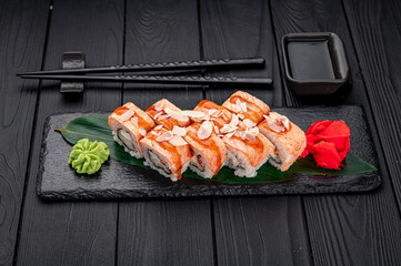 Sushi rolls with grilled salmon and pear.
