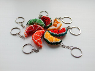 Colorful bead key chains on a white background