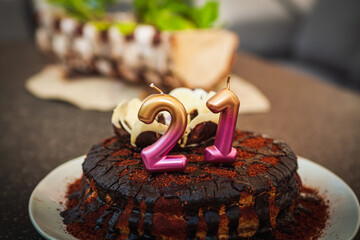 chocolate cake with a candle 21