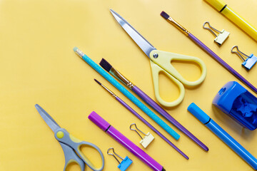 Colorful stationary school supplies on yellow trending background, space or text flat lay.various school items.Back to school concept