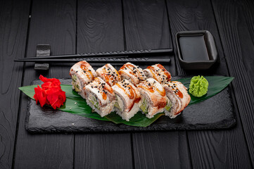 Sushi rolls japanese food on a dark background. Roll with eel