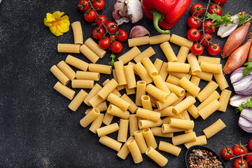 rigatoni raw pasta meal other ingredients food snack on the table copy space food background