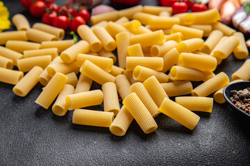 rigatoni raw pasta meal other ingredients food snack on the table copy space food background
