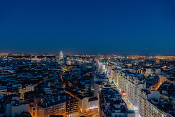 Obraz premium Madrid, Spain. April 6, 2022: Panoramic landscape at night from the Riu Plaza hotel.