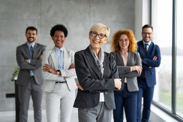 Portrait of  multi ethnic business team standing and looking at camera