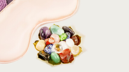 Relaxing ritual with crystals gemstones set and sleep mask on white background with copy spac. Esoteric spiritual practice, Healing Crystal Ritual, Relax Chakra. Relaxing at home, self care concept