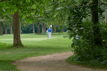 Person playing golf on the grass