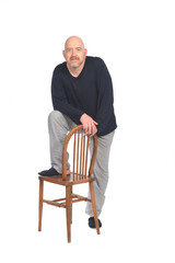 man with pajamas and chair