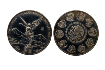 Anverso y reverso de la moneda troy de plata de 2003 con el ángel de la independencia y en el reverso los diferentes escudos del águila devorando una serpiente.