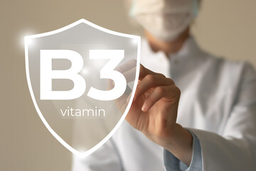 Molecular model of vitamin B3, Niacin. Shield in doctor`s hands with Vitamin B3. S