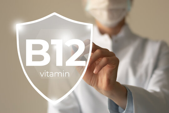 Molecular model of vitamin B12. Shield in doctor`s hands with Vitamin B12.