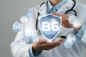 Molecular model of vitamin B6. Shield in doctor`s hands with Vitamin B6.