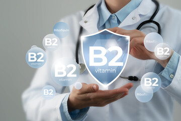 Molecular model of vitamin B2, Riboflavin. Shield in doctor`s hands with Vitamin B2.