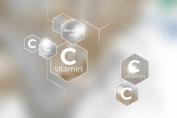 Immunity protection concept, vitamin C. Hexagons with Vitamin C name, blurry marble background.
