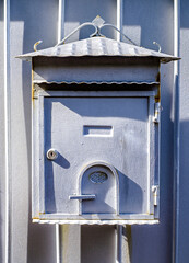 old letterbox at a door