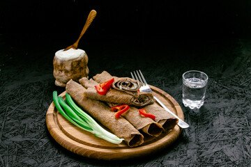 Pancakes. Blinks. Traditional dishes. Dark background