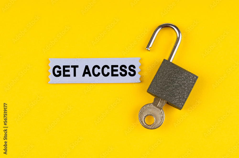 Poster on the yellow surface lies an open lock with a key, next to it is a sticker with the inscription - g