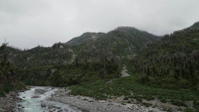 river running through the volcanic landscape of Chaiten