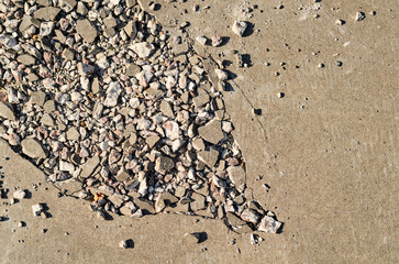 cement pavement damaged by a passing vehicle
