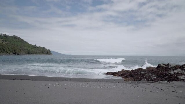 grey volcanic beach close to Chaiten in Patagonia