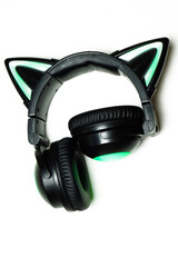 Fototapeta na wymiar Black wireless headphones isolated on a white background. A cosplay accessory. Wireless gaming headset with a cat ear. With backlight. Front View