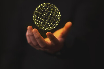 communications network held in the palm of a hand, yellow, black background