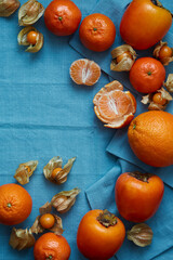 oranges and tangerines on a blue background