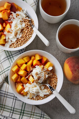 Greek yogurt with coconut, peaches and quinoa popcorn with a cup of tea