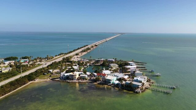 Aerial view of secluded luxury island and bridge surrounded by water in the Florida Keys, Marathon.
