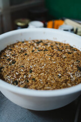 Seeds in bowl with water. They are hydrating to put them inside the bread dough.