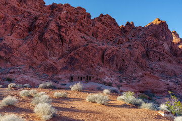 Colorful red sandstone formations shown at Valley of Fire in Nevada, United States. The park has a National Natural Landmark designation and is located within the Mojave Desert.