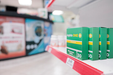 Empty pharmacy store filled with boxes of pharmaceutical products and drugs to help sick clients with disease. Drugstore shelves with packages of medication and bottles pills, medicine service