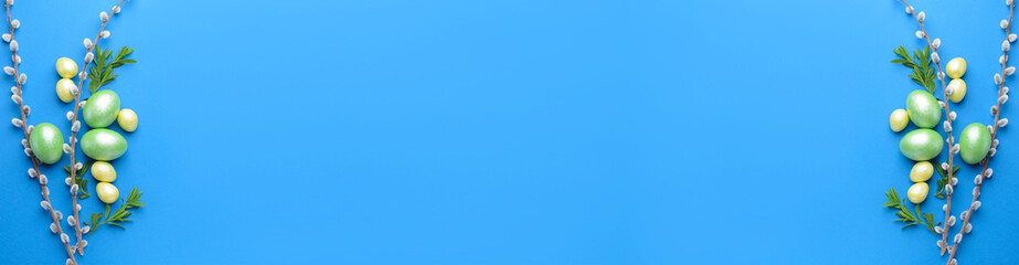 Banner with beautiful Easter eggs and pussy willow on blue background with space for text