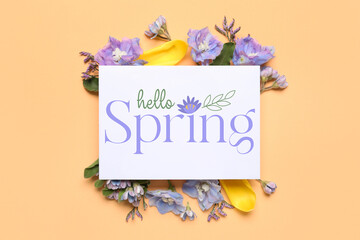 Card with text HELLO, SPRING and flowers on beige background