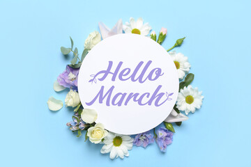 Card with text HELLO, MARCH and spring flowers on light blue background